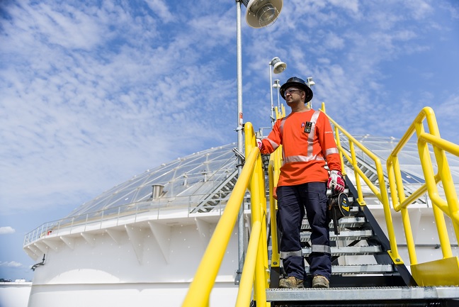 Enbridge employee on roof of crude oil tank