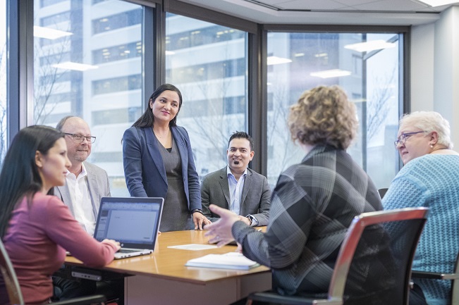 Group of employees in a boardroom setting