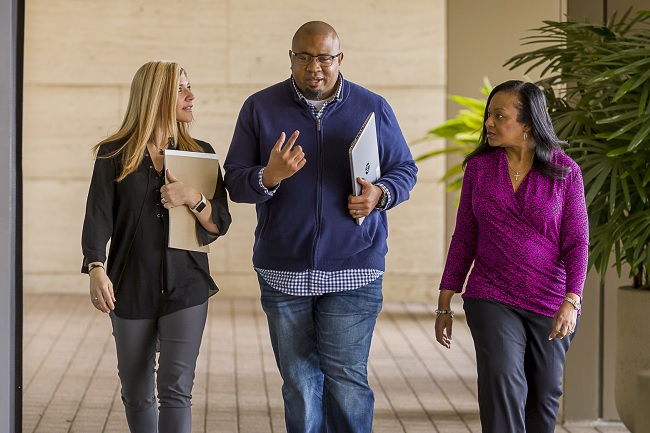 Employees walking down a hall