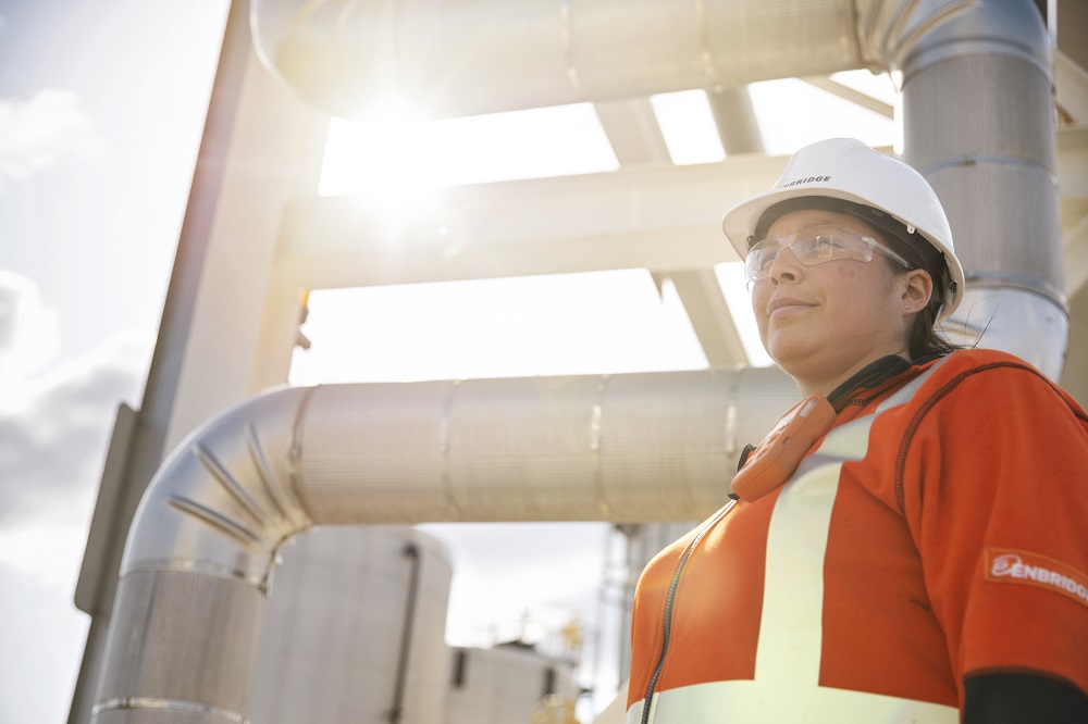 Worker in front of piping