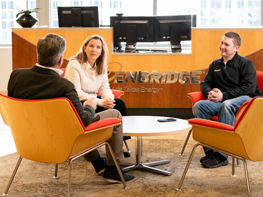 People sitting around a low table in an office setting