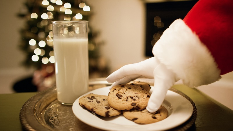 Santa eating cookies on Christmas Eve
