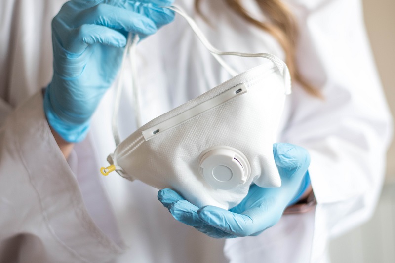 Nurse holding medical supplies