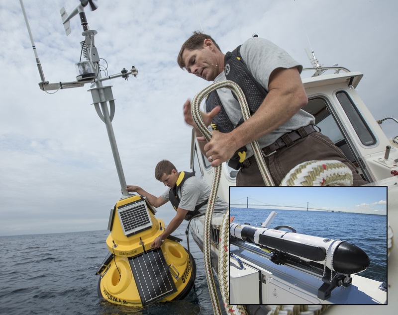 People launching a buoy from a boat
