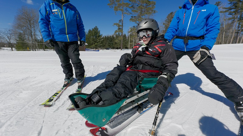 Disabled teen skiing on the slopes
