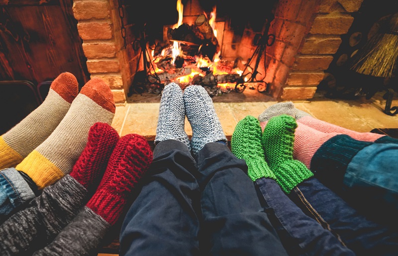 Stocking feet in front of a fire