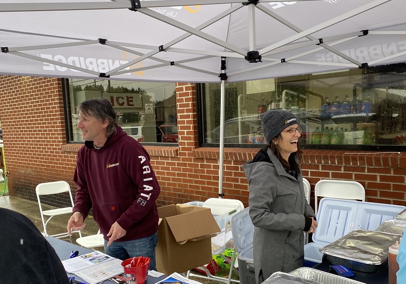 Two people smiling at volunteer event