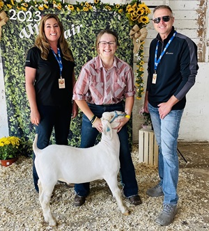 Teenage 4-H winner with a lamb
