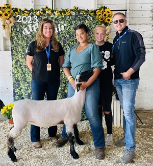 Teenage 4-H winner with a lamb