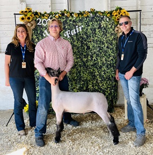 Teenage 4-H winner with a lamb