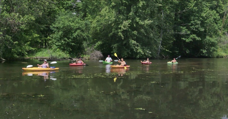 People kayaking on a river