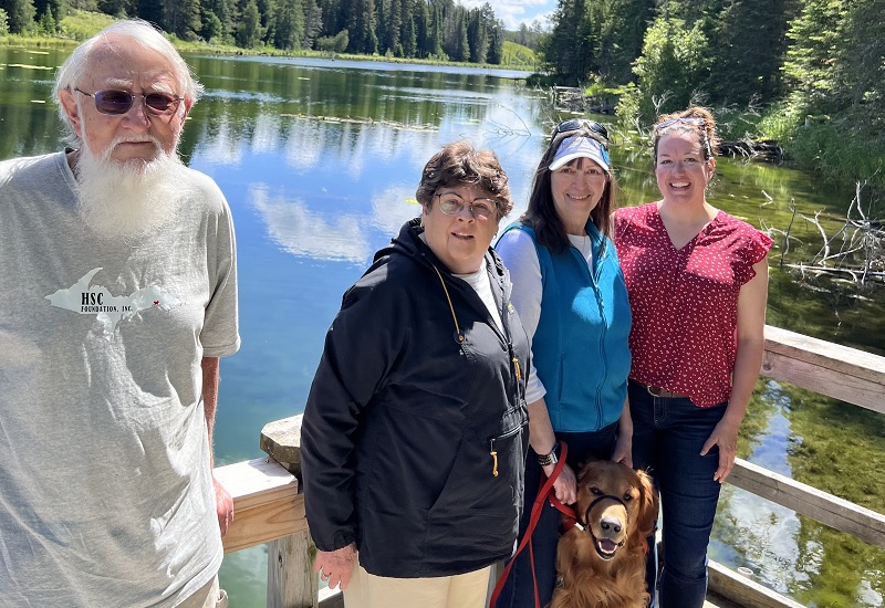 Group of people on bridge over water
