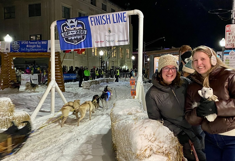 Bystanders cheer on sled dog race
