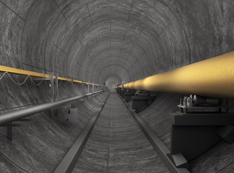 Concrete tunnel with pipe and cables