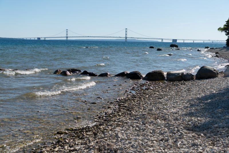 Shoreline of the Straits of Mackinac with the Mackinac Bridge in the background