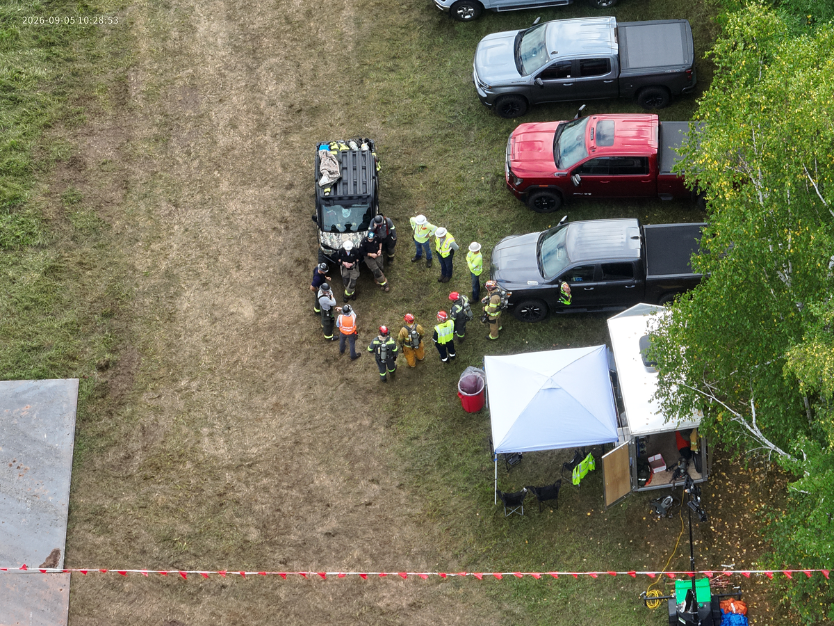 Aerial image of workers in a safety meeting