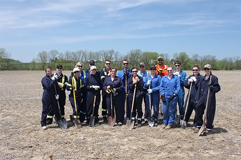 To celebrate the completion of the 8-year Lambton County Naturalization Project, 17 Enbridge staff joined SCRCA forestry specialists for a tree planting event on one of the properties in Wilkesport.