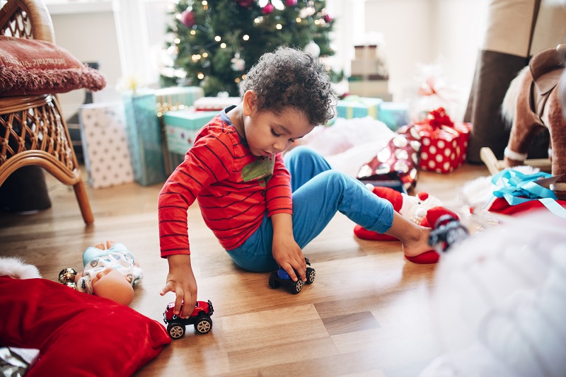 Child playing with toy during holidays