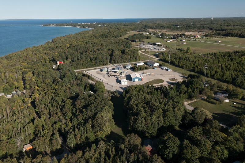 Facility surrounded by trees and water