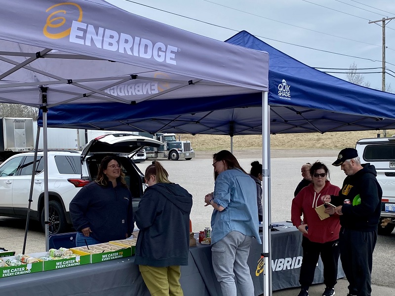 People gathering at a gas station event