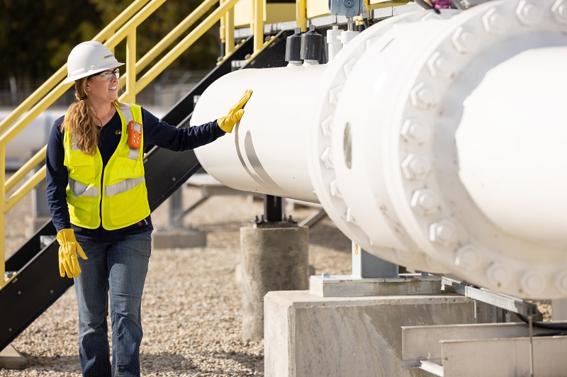 Women in hardhat at job site