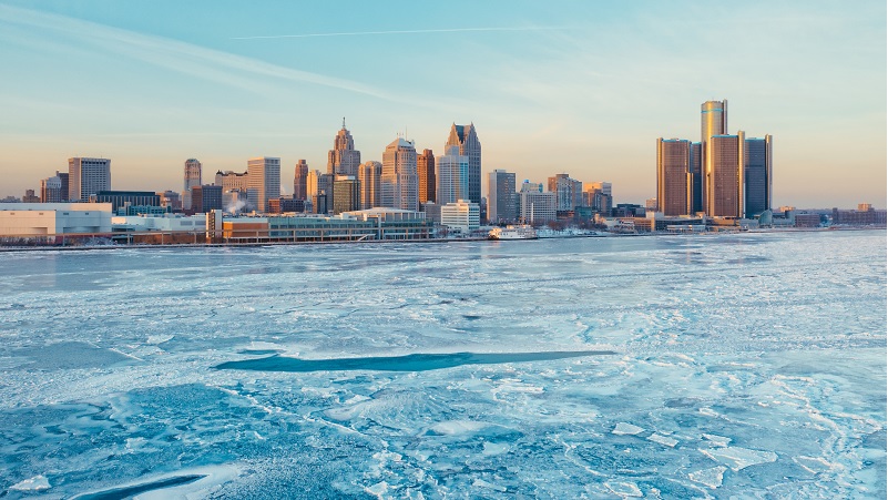 Frozen Detroit River and Detroit skyline in winter