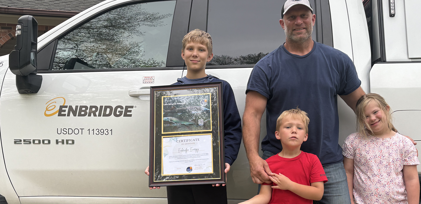 Dad with kids in front of a truck