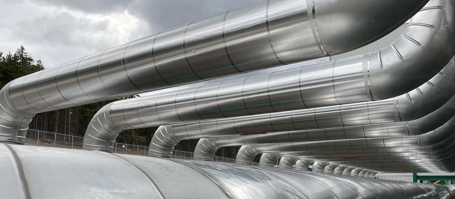 Shining silver pipes on a cloudy day