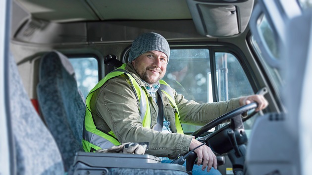 Front line worker driving a truck