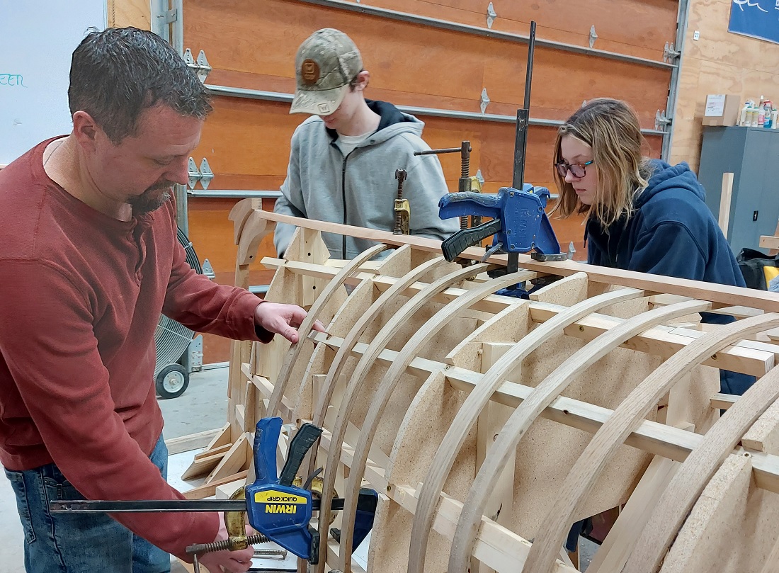 People building a boat