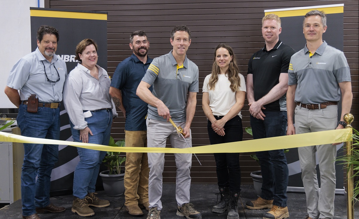 People cutting a ribbon