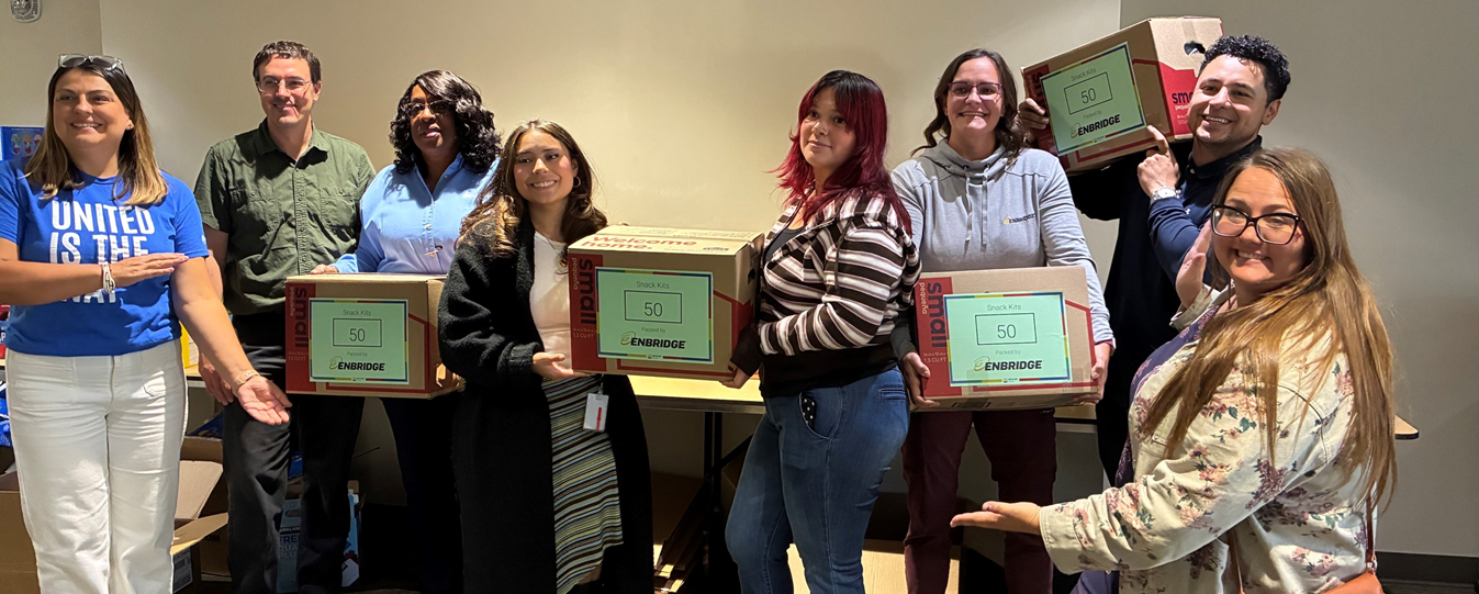 People holding up boxes